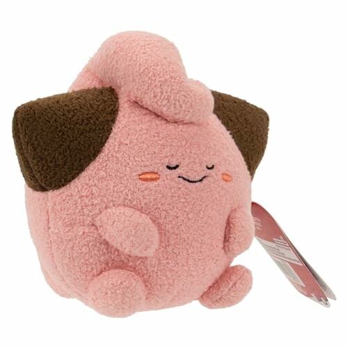 Schattige roze pluchen knuffel met bruine oren.