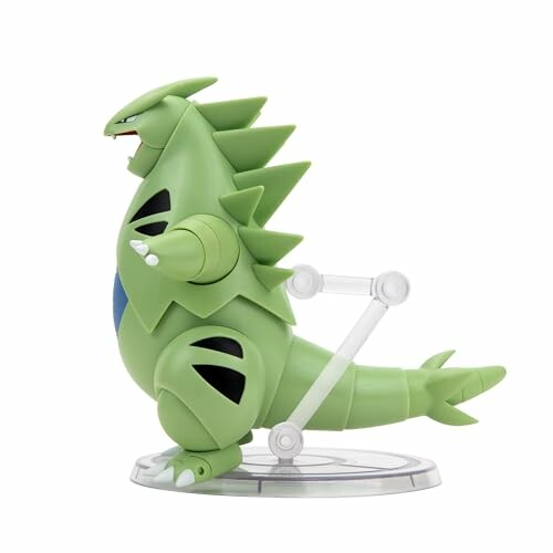 Groene monsterfiguur op standaard