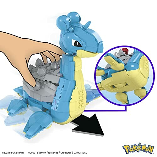 Bouwbare Lapras speelgoedset met hand voor schaal.